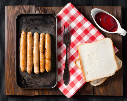 Juicy pork frankfurters served on a white plate – premium German-style pork sausages available online in Delhi, Noida, and Gurgaon